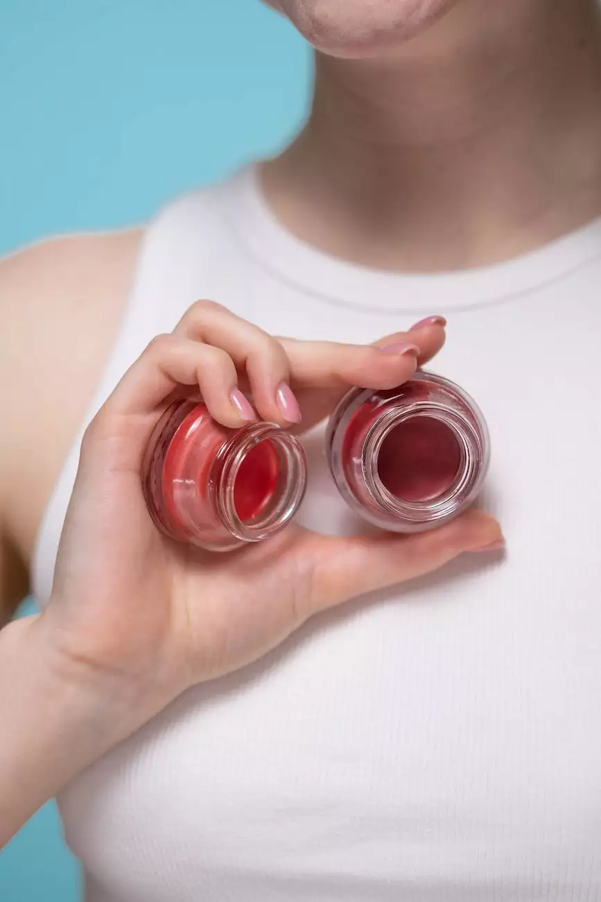 Two open pots of rose and berry colored cosmetics